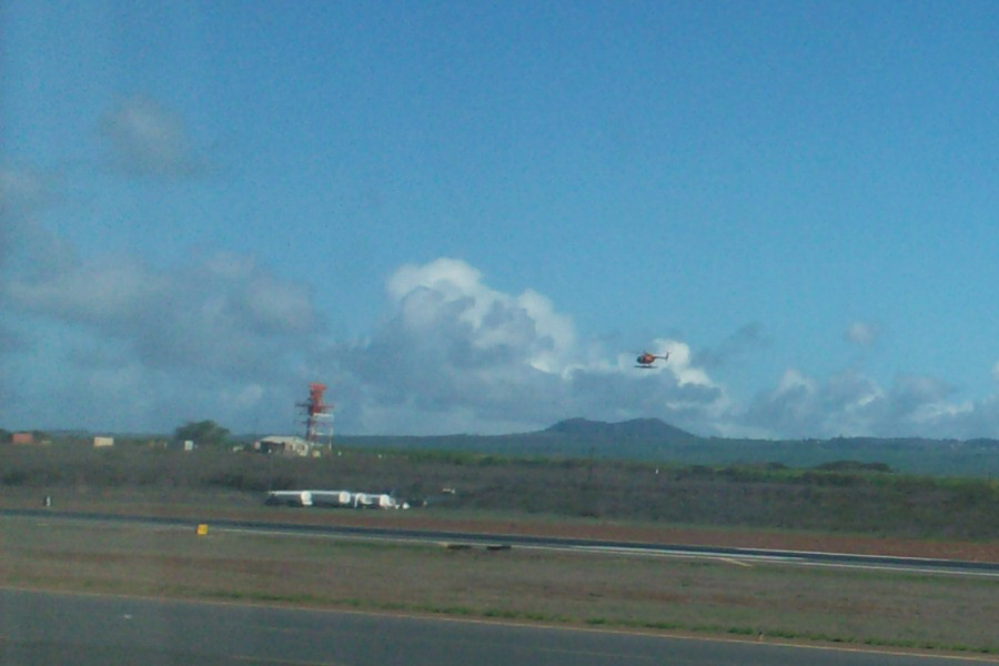 by the airport the helicockter flys by the airport the helicockter flys